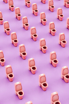 vertical pattern of Pink toilet on violet background