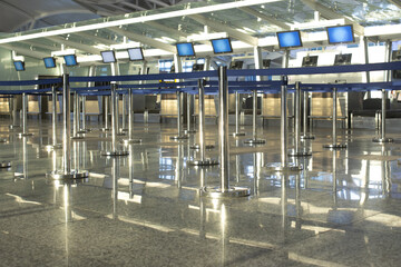 Coronavirus outbreak, empty check-in desks at the airport terminal due to pandemic of coronavirus an