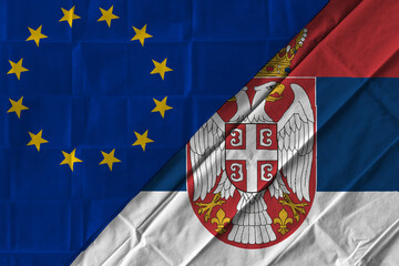 Concept of the relationship between the European Union (EU) and Serbia with two flags over each other