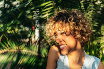 Portrait of attractive smiling woman with curly hair