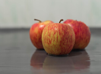 Juicy and fresh fruits lie on a gray background
