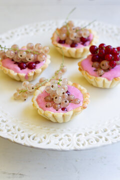 Red currant tart topped with fresh white currant
