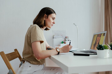 Professional psychologist having online meeting with client via laptop