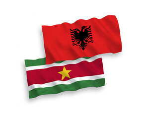 Flags of Republic of Suriname and Albania on a white background