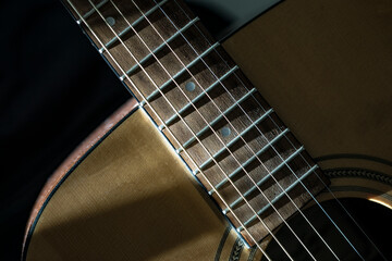 Obraz premium Guitar fingerboard close up on dark background