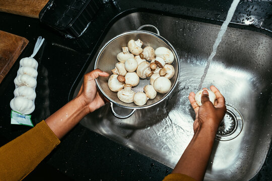 Woman Washing Mushrooms
