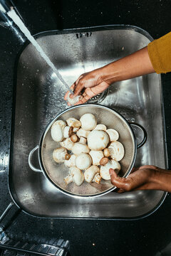 Woman Washing Mushrooms
