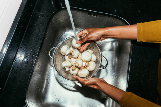 Woman Washing Mushrooms
