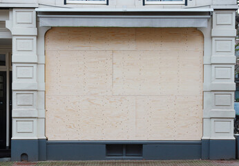 boarded up store window