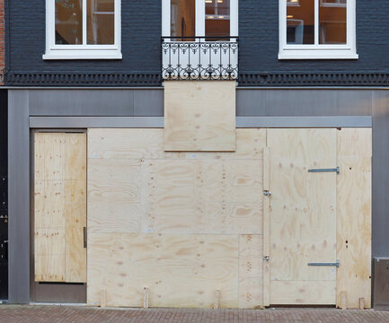 boarded up store window