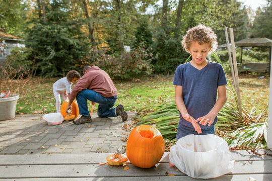  Boy Makes Disgusted Face At Slimy Pumpkin Seeds