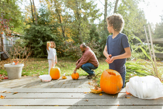  Boy admires sister's pumpkin seeds