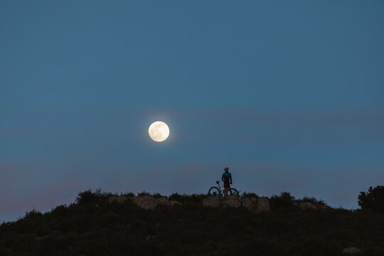 cyclist to the full moon