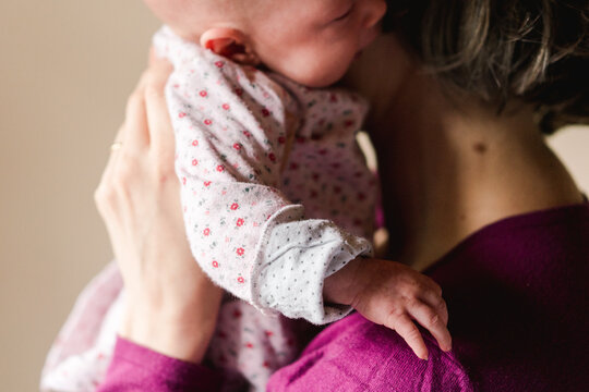 mother holding baby