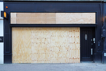 boarded up store window