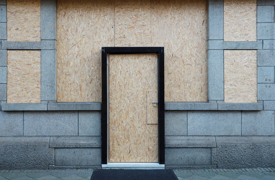 boarded up store window