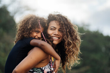 Obraz premium Happy Mom and Daughter in the Beach