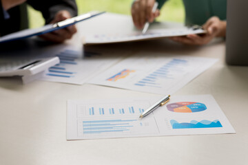 Team of business working together Creative in modern office, charts report and graphs banner, double exposure successful teamwork business planning concept.