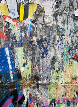 wall with torn posters