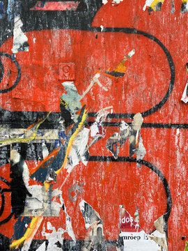wall with torn posters