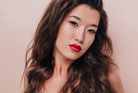 Pretty asian model with red lips 