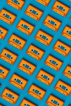pattern of Orange musicassette on blue background