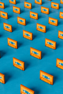 Orange musicassette on blue background