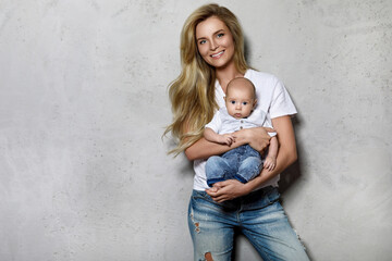 Beautiful young mother with her cute baby boy