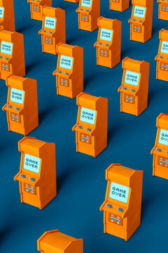 vertical image of a pattern of Orange arcade cabinet on blue background