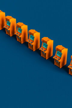 7 Orange arcade cabinet on blue background arranged