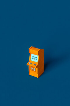 one Orange arcade cabinet on blue background