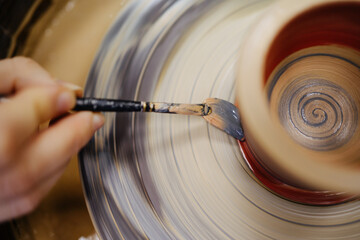 Painting finished ceramic pot