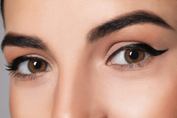 Beautiful woman with black eyeliner, closeup view