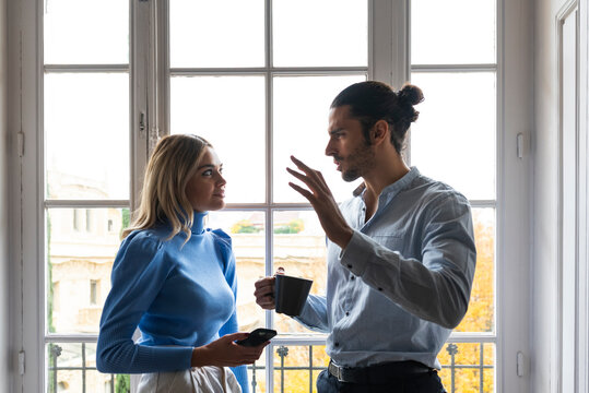 Two person talking to each other at home