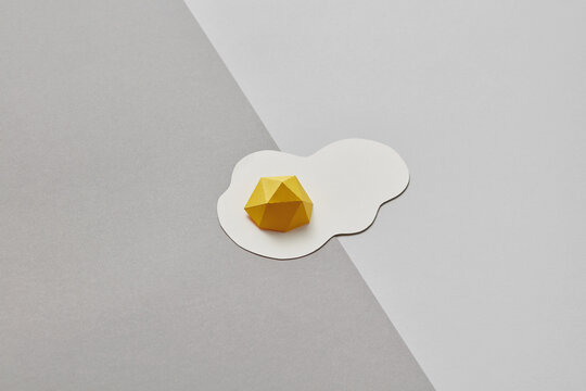 Flatlay of papercraft yellow egg