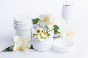Obraz na płótnie Canvas cosmetics in white jars. Medical spa supplies