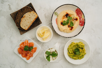 Tapas hummus, salmon, cottage cheese, smashed avocado and bread