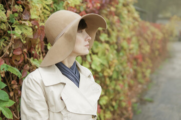 Loneliness concept. Woman in the street in autumn scenery