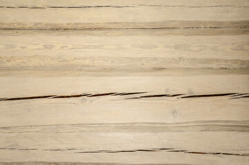The texture of cracked wooden logs is beige. Background texture.Pattern