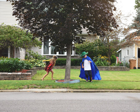 Super Hero Children Playing Outside