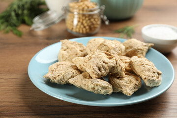 Dried soy meat on wooden table, closeup