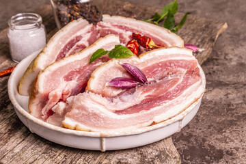 Raw pork belly with rind, peritoneum meat, spices and herbs