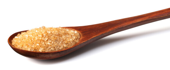 yellow sugar in the wooden spoon, isolated on white