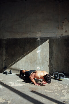 young man training in his garage