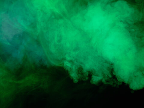 Green smoke on black background