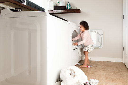 Girl loading dryer