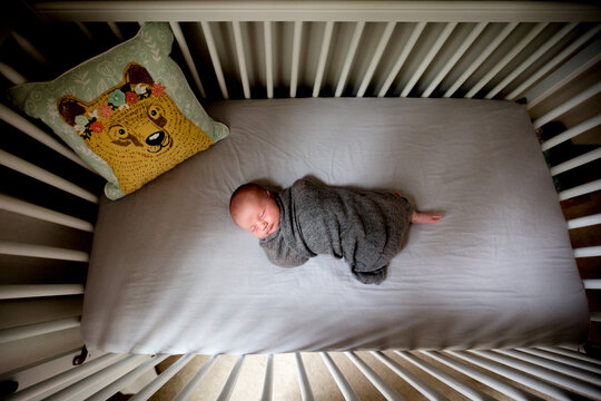 Birdseye view of baby sleeping in crib