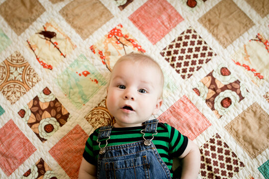 Portrait Of Baby On Quilt 