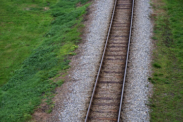 Railway bed. Fragment of railway tracks, top view, rails and sleepers.
