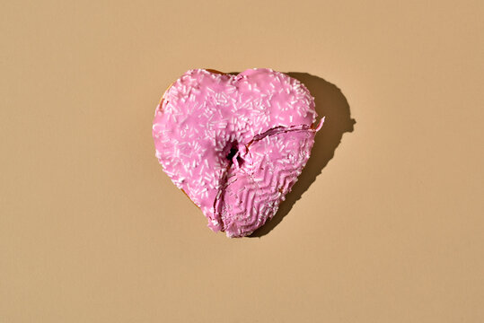 trampled pink heart-shaped donut